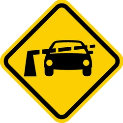Warning for a railroad crossing with barriers.