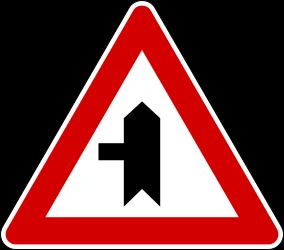Warning for a crossroad with a side road on the left.