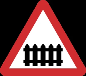 Warning for a railroad crossing with barriers.