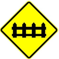 Warning for a railroad crossing with barriers.