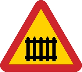 Warning for a railroad crossing with barriers.
